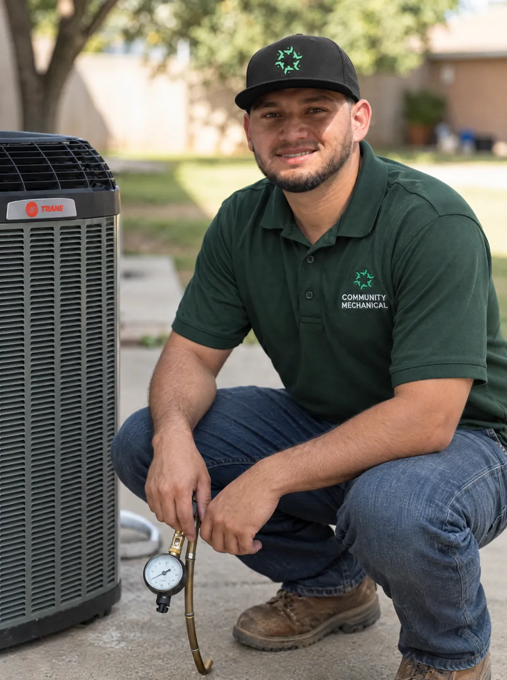 Community Mechanical technician servicing an outdoor AC unit