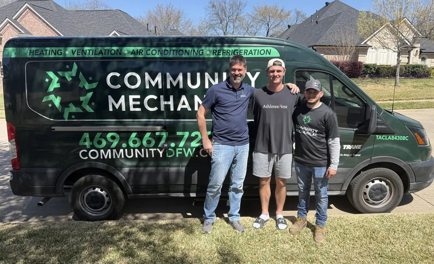 Chris from Community Mechanical, Brandon Aubrey, and technician Alex standing in front of a Community Mechanical van